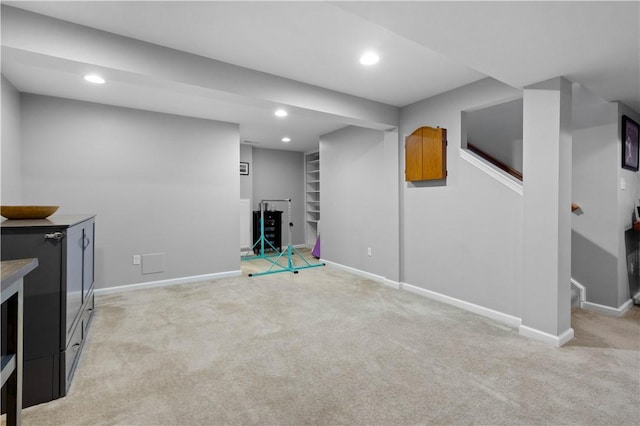 265 Sunrise Dr, Collier Twp, PA 15106 - finished below grade area with light carpet, recessed lighting, built in shelves, and stairway