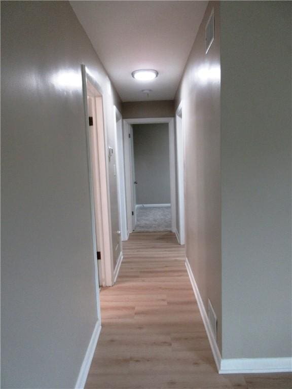 552 Heinz Camp Rd, Perry Twp Law, PA 16051 - corridor featuring baseboards and light wood-style floors