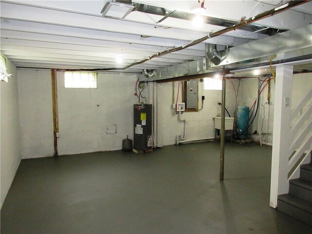 552 Heinz Camp Rd, Perry Twp Law, PA 16051 - basement with electric water heater, electric panel, and a water pressure tank