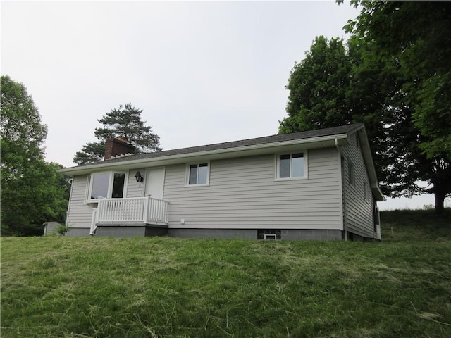 552 Heinz Camp Rd, Perry Twp Law, PA 16051 - rear view of house with a chimney and a yard