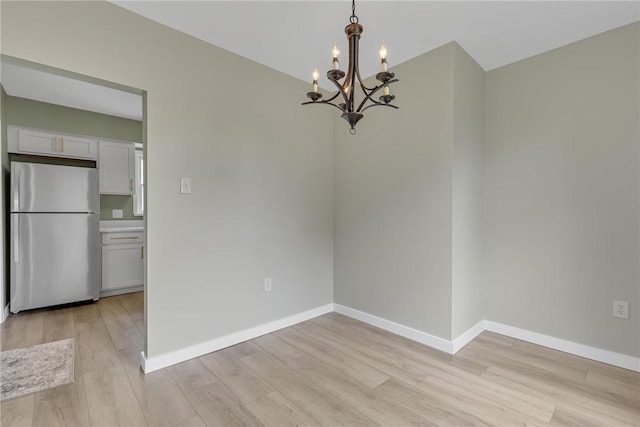 452 Canal St, Beaver, PA 15009 - unfurnished dining area featuring a chandelier and light wood-style flooring