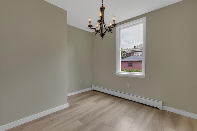452 Canal St, Beaver, PA 15009 - empty room featuring baseboard heating, a chandelier, and wood finished floors