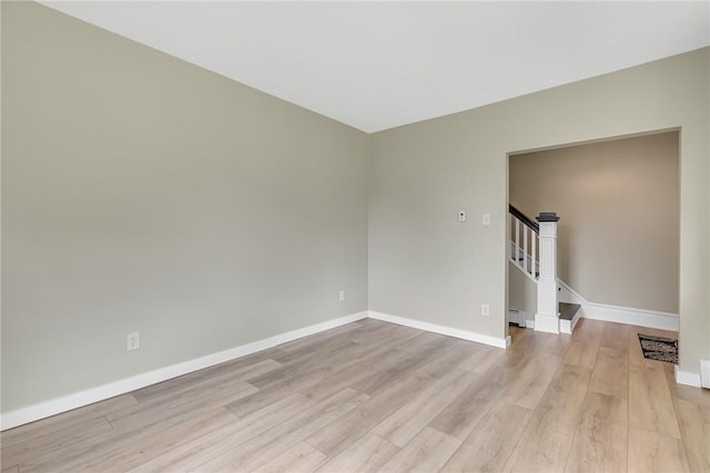 452 Canal St, Beaver, PA 15009 - empty room featuring light wood-style floors, stairs, and baseboard heating