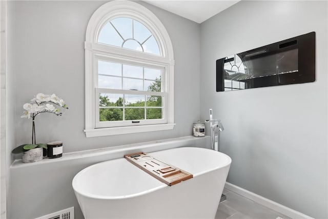 108 Ascot Ct, Lancaster Twp, PA 16037 - bathroom with healthy amount of natural light and a freestanding tub