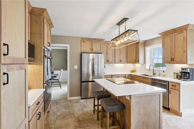 108 Ascot Ct, Lancaster Twp, PA 16037 - kitchen with appliances with stainless steel finishes, a center island, a breakfast bar, light countertops, and light tile patterned flooring