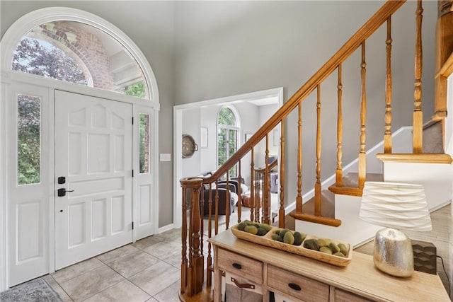 108 Ascot Ct, Lancaster Twp, PA 16037 - entryway with light tile patterned flooring, stairs, and a towering ceiling