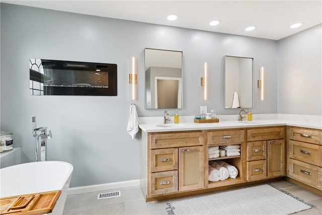 108 Ascot Ct, Lancaster Twp, PA 16037 - full bathroom with double vanity, a freestanding bath, tile patterned floors, and recessed lighting