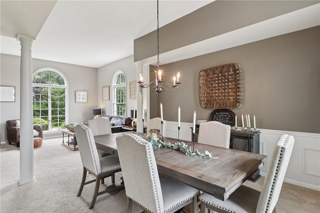 108 Ascot Ct, Lancaster Twp, PA 16037 - dining area featuring light carpet, ornate columns, and a chandelier