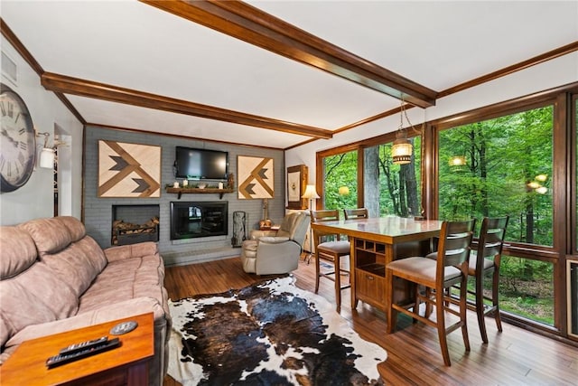 150 Buckwheat Dr, Pine Twp Nal, PA 15044 - living area featuring beam ceiling, wood finished floors, a brick fireplace, and crown molding