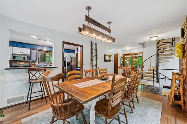 150 Buckwheat Dr, Pine Twp Nal, PA 15044 - dining space with stairway and wood finished floors