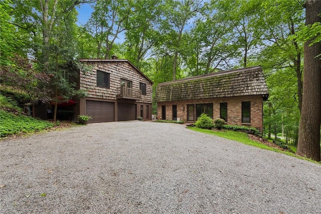 150 Buckwheat Dr, Pine Twp Nal, PA 15044 - view of front of home with a garage, mansard roof, driveway, and brick siding