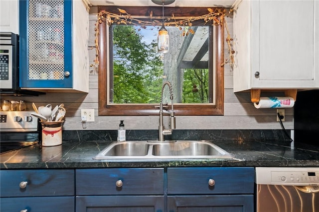150 Buckwheat Dr, Pine Twp Nal, PA 15044 - kitchen with stainless steel appliances, backsplash, white cabinetry, and healthy amount of natural light