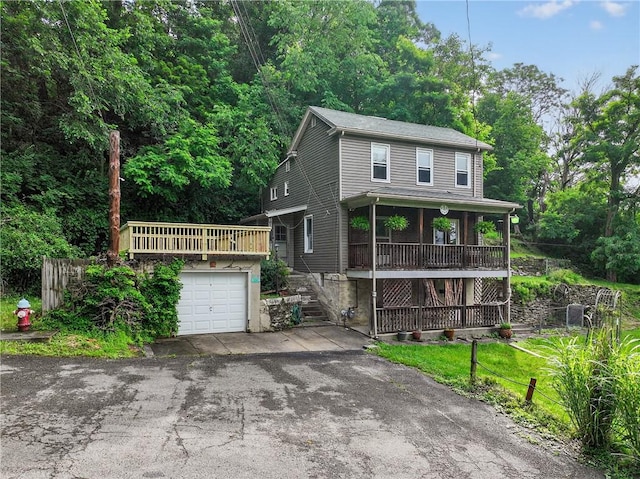 226 Herndon, Elliott, PA 15220 - view of front of home featuring asphalt driveway, stairs, and a garage