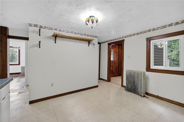 226 Herndon, Elliott, PA 15220 - spare room with radiator heating unit and a textured ceiling