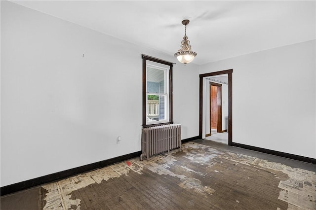 226 Herndon, Elliott, PA 15220 - spare room featuring radiator heating unit, wood-type flooring, and a chandelier