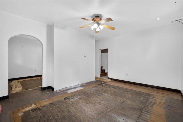 226 Herndon, Elliott, PA 15220 - spare room with arched walkways, hardwood / wood-style floors, ceiling fan, and stairway