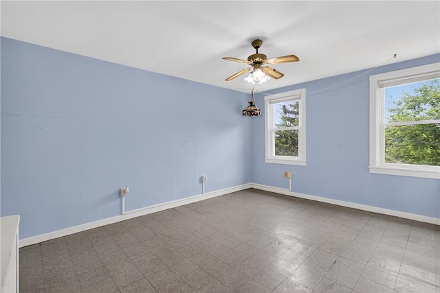 226 Herndon, Elliott, PA 15220 - empty room with baseboards and a ceiling fan