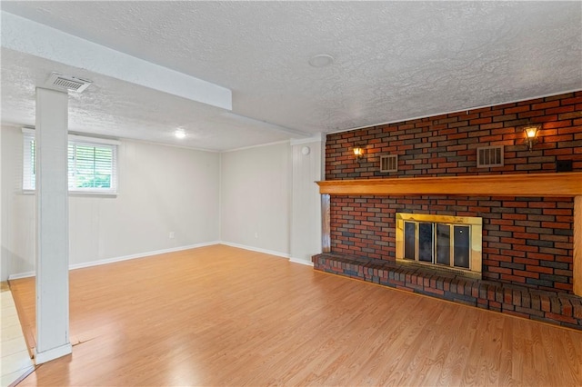 1032 Grove St, Monaca, PA 15061 - unfurnished living room featuring wood finished floors, a textured ceiling, and a fireplace
