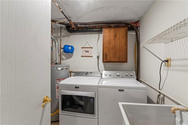 1032 Grove St, Monaca, PA 15061 - laundry area with washer and clothes dryer, cabinet space, and water heater