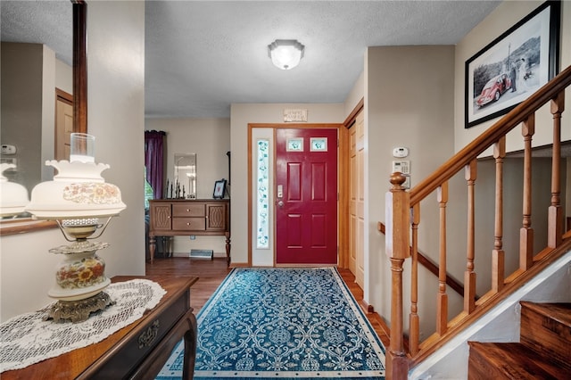 321 Dairy Farm Rd, Allegheny Twp Wml, PA 15068 - entrance foyer with a textured ceiling, wood finished floors, and stairway
