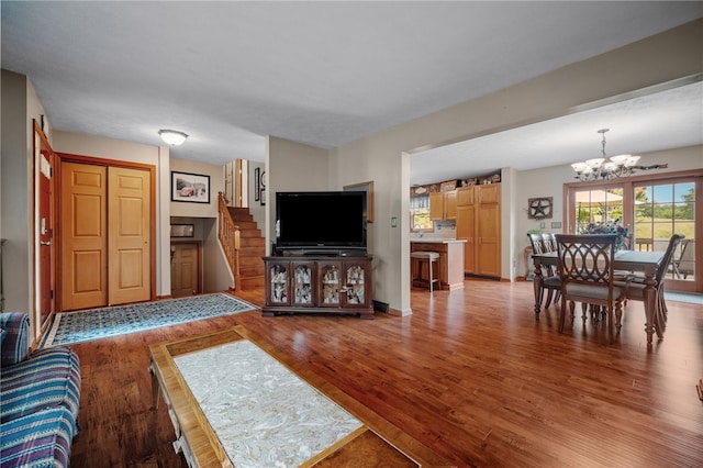321 Dairy Farm Rd, Allegheny Twp Wml, PA 15068 - living area with a chandelier, wood finished floors, and stairs