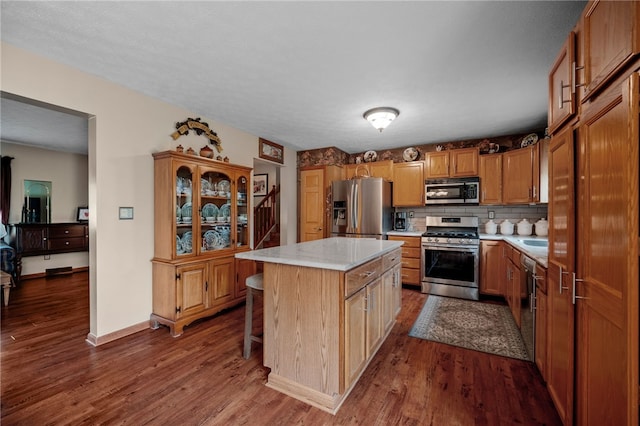 321 Dairy Farm Rd, Allegheny Twp Wml, PA 15068 - kitchen with appliances with stainless steel finishes, light countertops, and dark wood-style flooring