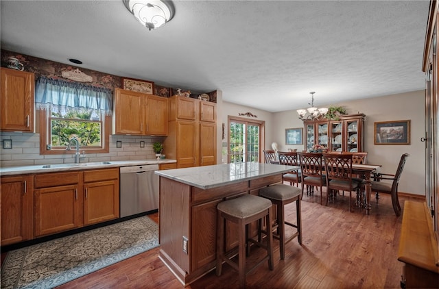 321 Dairy Farm Rd, Allegheny Twp Wml, PA 15068 - kitchen with dishwasher, light countertops, a textured ceiling, healthy amount of natural light, and wood finished floors