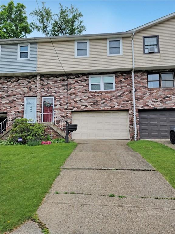 611 Broadhead Ave, Crafton, PA 15205 - townhome / multi-family property featuring driveway, a garage, a front yard, and brick siding
