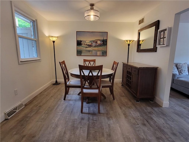 611 Broadhead Ave, Crafton, PA 15205 - dining area with dark wood-style flooring and baseboards
