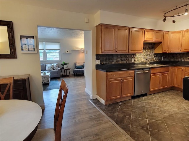 611 Broadhead Ave, Crafton, PA 15205 - kitchen featuring dishwasher, dark countertops, backsplash, and rail lighting