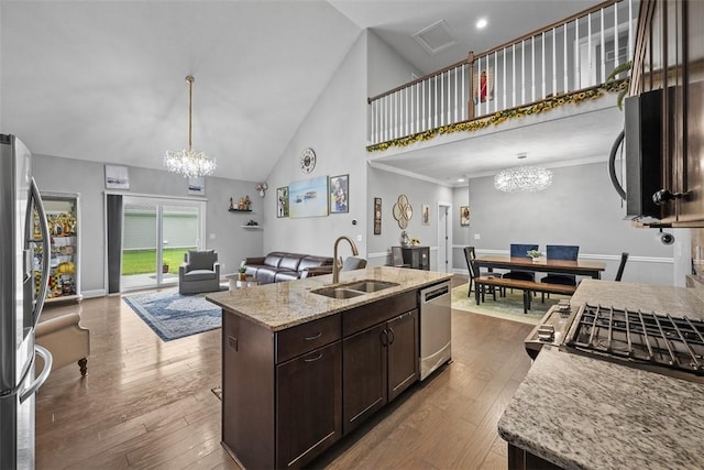 503 Tuscarora Rd, Marshall, PA 16046 - kitchen featuring appliances with stainless steel finishes, a chandelier, high vaulted ceiling, dark brown cabinetry, and dark wood-type flooring