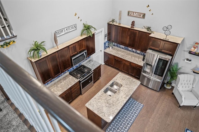 503 Tuscarora Rd, Marshall, PA 16046 - kitchen with appliances with stainless steel finishes, dark brown cabinets, and wood finished floors