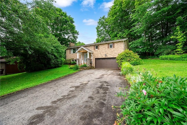 202 Village Ln, New Wilmington Boro, PA 16142 - view of front of home with driveway, a chimney, an attached garage, and a front yard