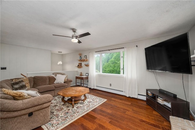 202 Village Ln, New Wilmington Boro, PA 16142 - living room with wood finished floors, ceiling fan, and baseboard heating