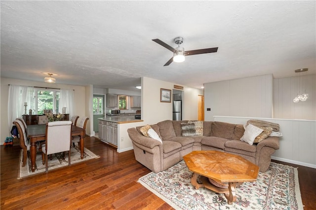 202 Village Ln, New Wilmington Boro, PA 16142 - living room with dark wood-type flooring, ceiling fan, and a textured ceiling