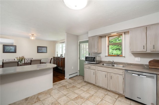 202 Village Ln, New Wilmington Boro, PA 16142 - kitchen with appliances with stainless steel finishes, a wall unit AC, a baseboard radiator, and plenty of natural light