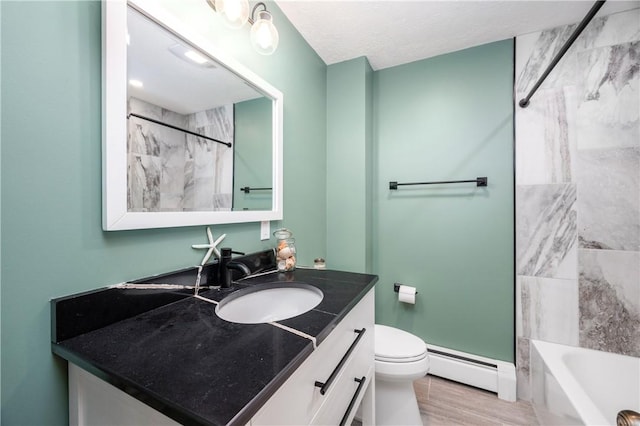 202 Village Ln, New Wilmington Boro, PA 16142 - bathroom featuring a baseboard radiator, vanity, shower / bath combination, and wood finished floors