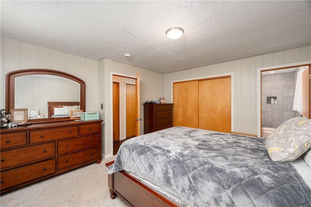 202 Village Ln, New Wilmington Boro, PA 16142 - carpeted bedroom featuring a textured ceiling and a closet
