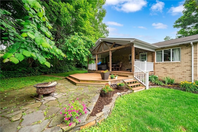 202 Village Ln, New Wilmington Boro, PA 16142 - view of grassy yard featuring an outdoor fire pit and a patio