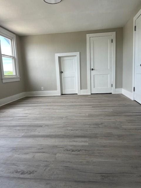 819 Forest St, Latrobe, PA 15650 - unfurnished bedroom with baseboards and wood finished floors