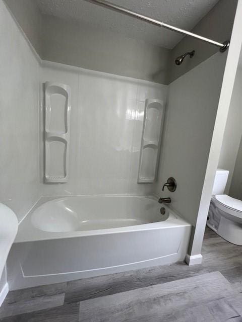 819 Forest St, Latrobe, PA 15650 - full bathroom featuring wood finished floors and washtub / shower combination