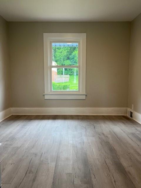 819 Forest St, Latrobe, PA 15650 - empty room featuring wood finished floors and baseboards
