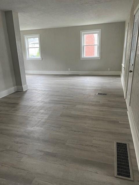 819 Forest St, Latrobe, PA 15650 - spare room featuring wood finished floors and a textured ceiling