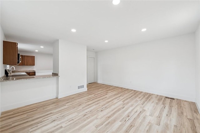634 Euclid Ave, Canonsburg, PA 15317 - unfurnished living room featuring recessed lighting and light wood finished floors