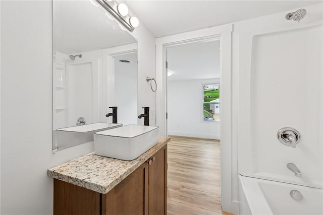 634 Euclid Ave, Canonsburg, PA 15317 - bathroom with vanity, wood finished floors, and bathtub / shower combination