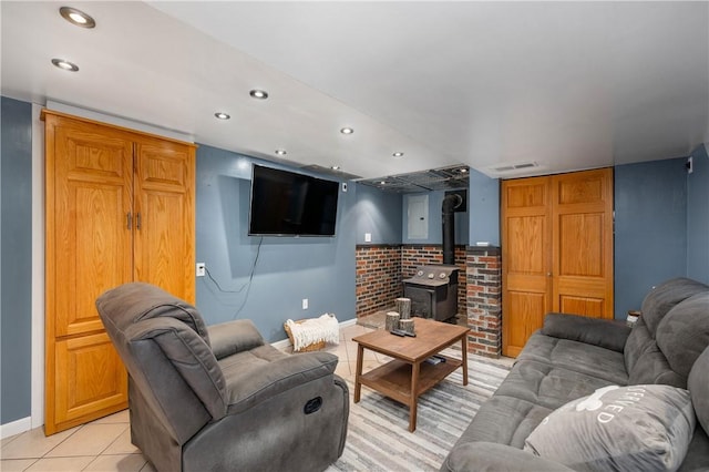 1072 N Ave, Baden, PA 15005 - living room featuring recessed lighting, light tile patterned flooring, and a wood stove