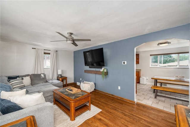 1072 N Ave, Baden, PA 15005 - living room with arched walkways, ceiling fan, and wood finished floors