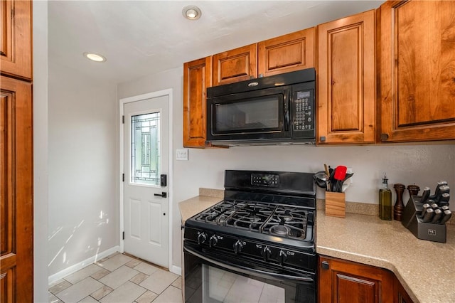 1072 N Ave, Baden, PA 15005 - kitchen featuring black appliances, light countertops, brown cabinets, recessed lighting, and light tile patterned floors