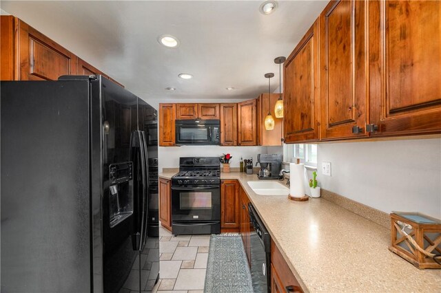 1072 N Ave, Baden, PA 15005 - kitchen featuring black appliances, light countertops, brown cabinets, recessed lighting, and decorative light fixtures