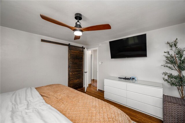 1072 N Ave, Baden, PA 15005 - bedroom with wood finished floors, a barn door, and a ceiling fan